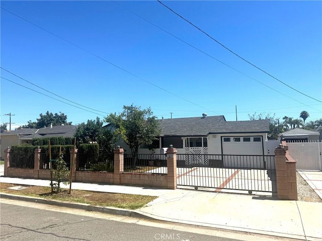 7892 8th St, Buena Park, CA 90621 - view of front of home featuring a fenced front yard, concrete driveway, a garage, and roof with shingles