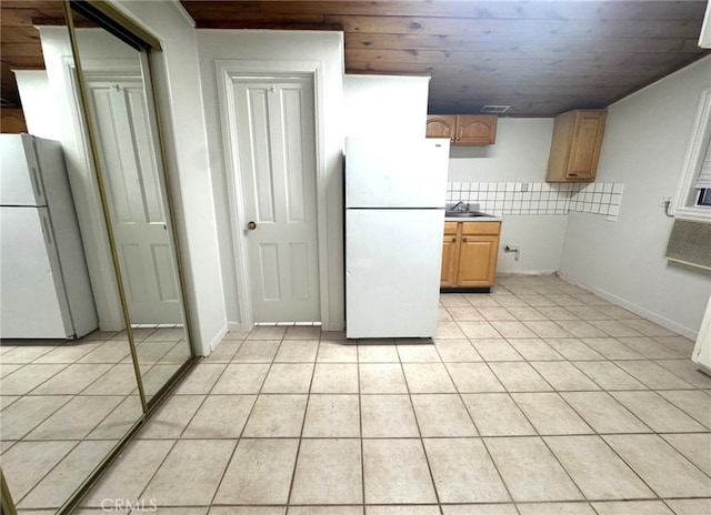 7892 8th St, Buena Park, CA 90621 - kitchen with freestanding refrigerator, light tile patterned floors, and wooden ceiling