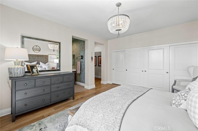 3 Stockmen Rd, Ladera Ranch, CA 92694 - bedroom with wood finished floors, a chandelier, and a closet