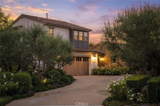 3 Stockmen Rd, Ladera Ranch, CA 92694 - mediterranean / spanish-style home featuring a tile roof, a garage, concrete driveway, and stucco siding