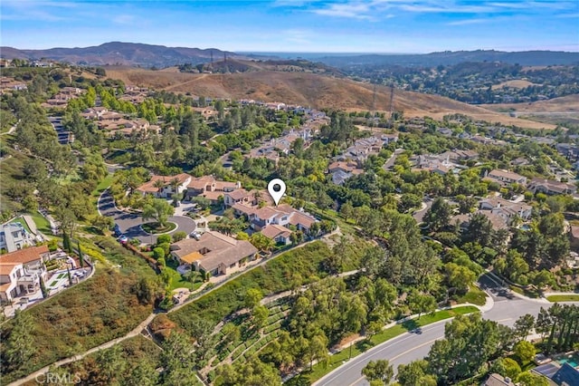 3 Stockmen Rd, Ladera Ranch, CA 92694 - aerial overview of property's location with a mountainous background and nearby suburban area