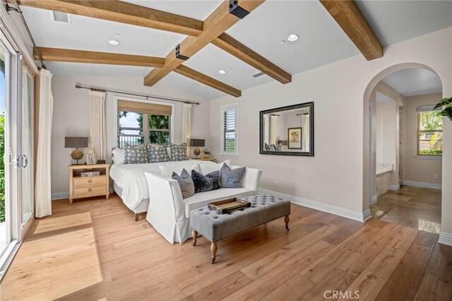 3 Stockmen Rd, Ladera Ranch, CA 92694 - bedroom with multiple windows, arched walkways, light wood-style floors, and recessed lighting
