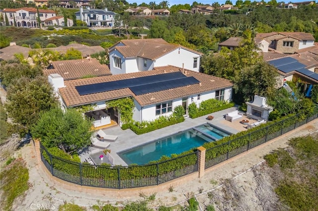 3 Stockmen Rd, Ladera Ranch, CA 92694 - back of house featuring a fenced backyard, roof mounted solar panels, a patio, and a residential view