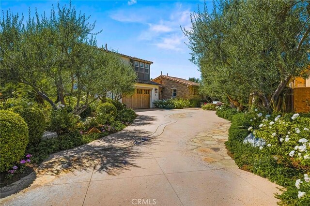 3 Stockmen Rd, Ladera Ranch, CA 92694 - view of front of property with concrete driveway, a garage, and stone siding