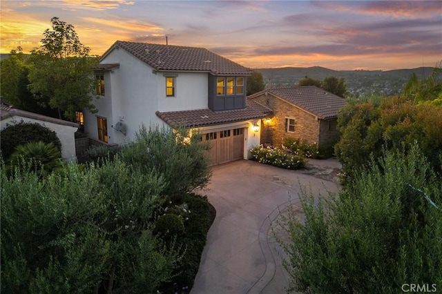 3 Stockmen Rd, Ladera Ranch, CA 92694 - view of front facade with a tile roof, stucco siding, concrete driveway, and an attached garage