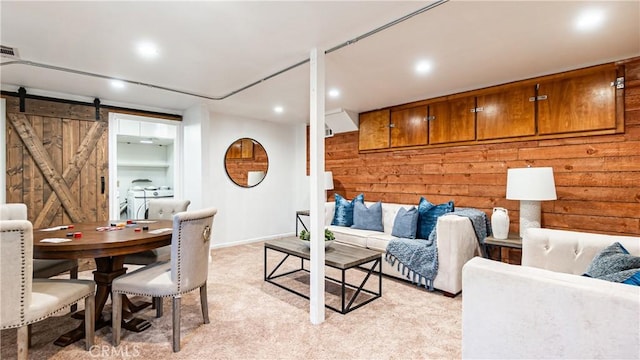 29282 Pine Dr, Cedar Glen, CA 92321 - living area with light colored carpet, a barn door, recessed lighting, and wood walls