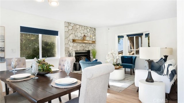 29282 Pine Dr, Cedar Glen, CA 92321 - dining room with plenty of natural light, wood finished floors, and a fireplace