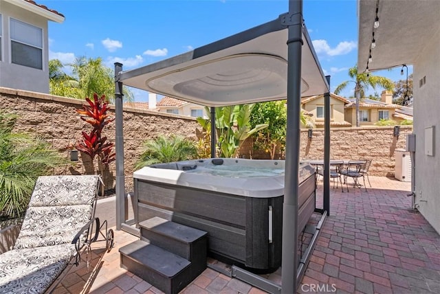 15 Surfbird Ln, Aliso Viejo, CA 92656 - fenced backyard featuring a hot tub and a patio area