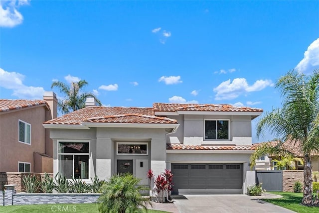 15 Surfbird Ln, Aliso Viejo, CA 92656 - mediterranean / spanish-style home featuring stucco siding, concrete driveway, and a tile roof