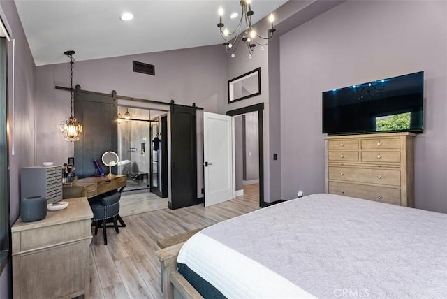 15 Surfbird Ln, Aliso Viejo, CA 92656 - bedroom featuring light wood finished floors, an office area, high vaulted ceiling, a chandelier, and a barn door