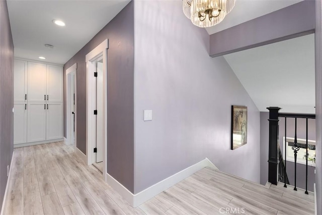 15 Surfbird Ln, Aliso Viejo, CA 92656 - corridor with light wood-type flooring, a chandelier, recessed lighting, and an upstairs landing