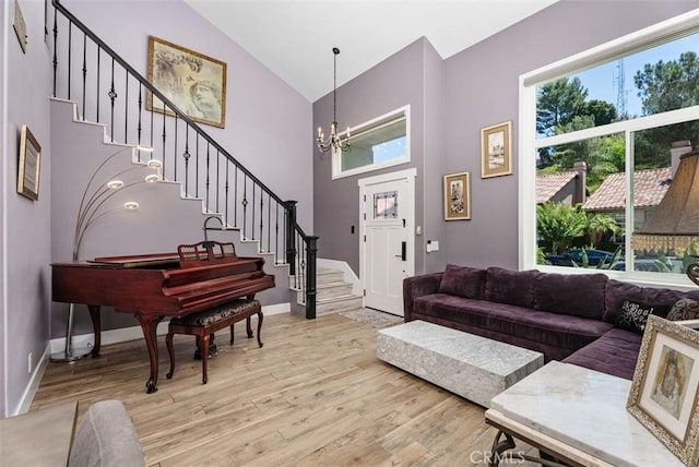 15 Surfbird Ln, Aliso Viejo, CA 92656 - foyer entrance featuring stairs, high vaulted ceiling, light wood-style flooring, and a chandelier