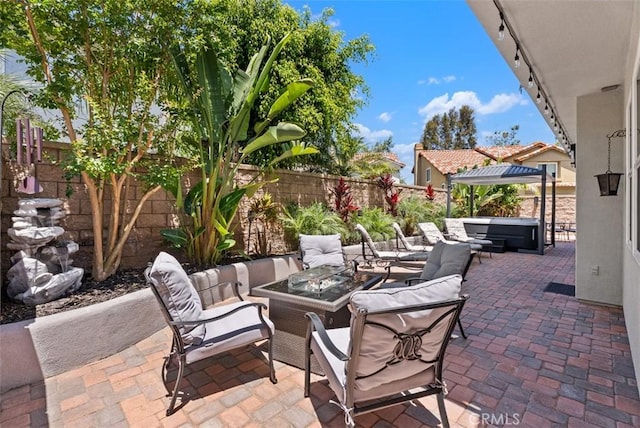 15 Surfbird Ln, Aliso Viejo, CA 92656 - fenced backyard with a patio, an outdoor living space with a fire pit, and a hot tub
