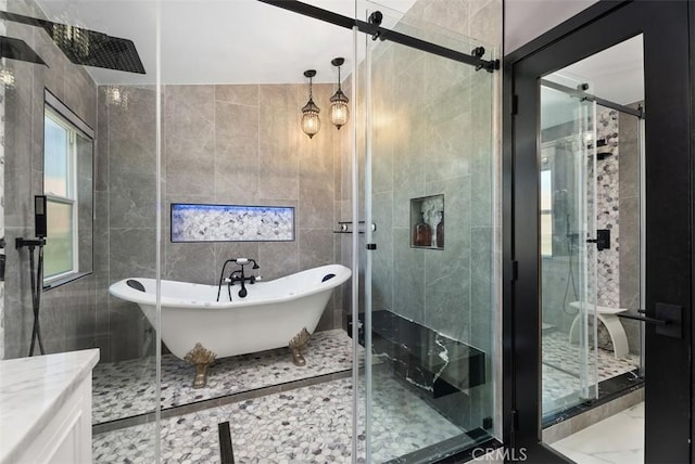 15 Surfbird Ln, Aliso Viejo, CA 92656 - bathroom featuring a freestanding bath, a shower stall, tile walls, and vanity