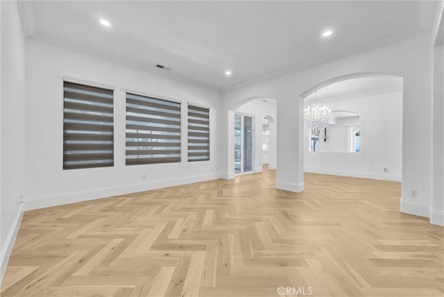 12149 Jonathan Dr, Riverside, CA 92503 - empty room featuring arched walkways, a chandelier, crown molding, and recessed lighting