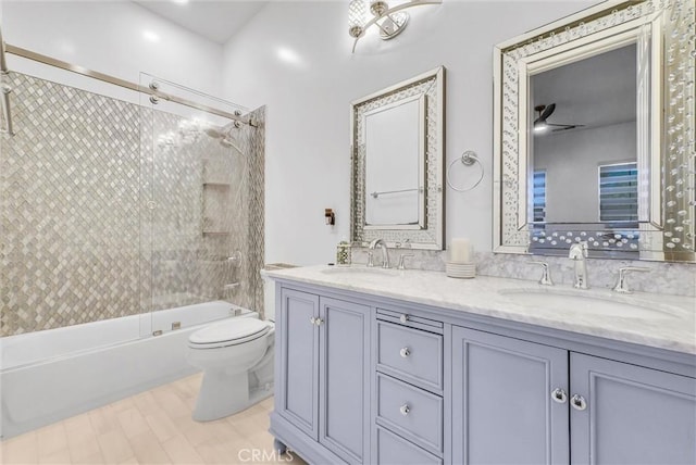 12149 Jonathan Dr, Riverside, CA 92503 - full bathroom featuring double vanity, washtub / shower combination, and wood finished floors