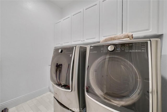 12149 Jonathan Dr, Riverside, CA 92503 - laundry area featuring separate washer and dryer and cabinet space