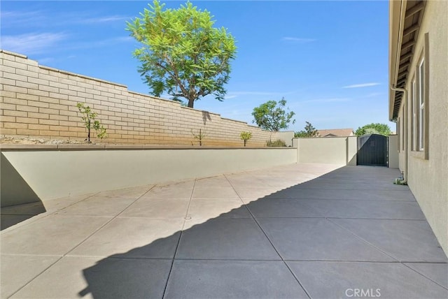 12149 Jonathan Dr, Riverside, CA 92503 - fenced backyard with a gate and a patio