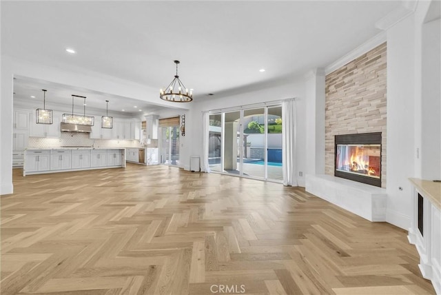 12149 Jonathan Dr, Riverside, CA 92503 - unfurnished living room with a fireplace, recessed lighting, and a chandelier
