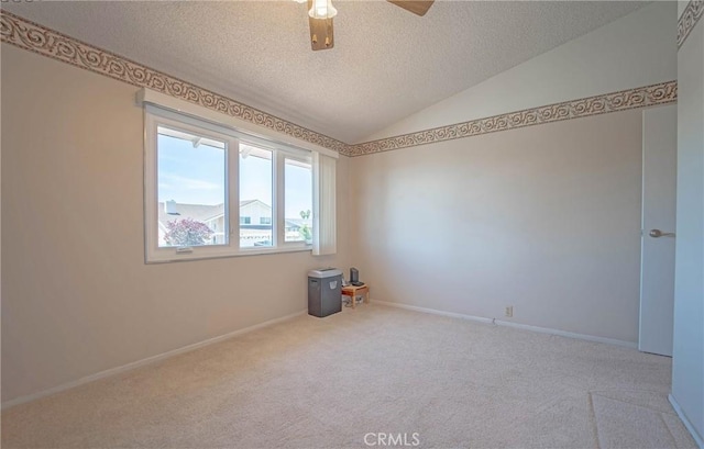 24612 Artemia Ave, Mission Viejo, CA 92691 - carpeted spare room with a textured ceiling, vaulted ceiling, and a ceiling fan