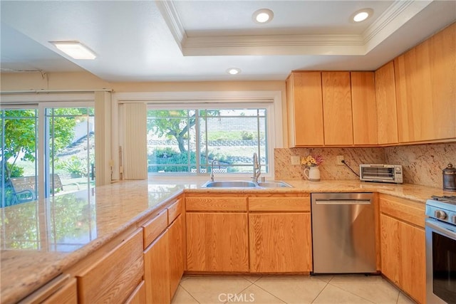 24612 Artemia Ave, Mission Viejo, CA 92691 - kitchen with stainless steel appliances, ornamental molding, a tray ceiling, backsplash, and light tile patterned floors