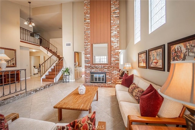 24612 Artemia Ave, Mission Viejo, CA 92691 - living room with a high ceiling, a fireplace, tile patterned floors, and stairway
