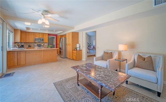 24612 Artemia Ave, Mission Viejo, CA 92691 - living area featuring a ceiling fan, a raised ceiling, and light tile patterned floors