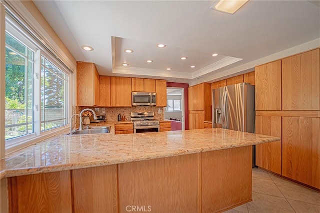 24612 Artemia Ave, Mission Viejo, CA 92691 - kitchen featuring stainless steel appliances, healthy amount of natural light, decorative backsplash, a tray ceiling, and recessed lighting