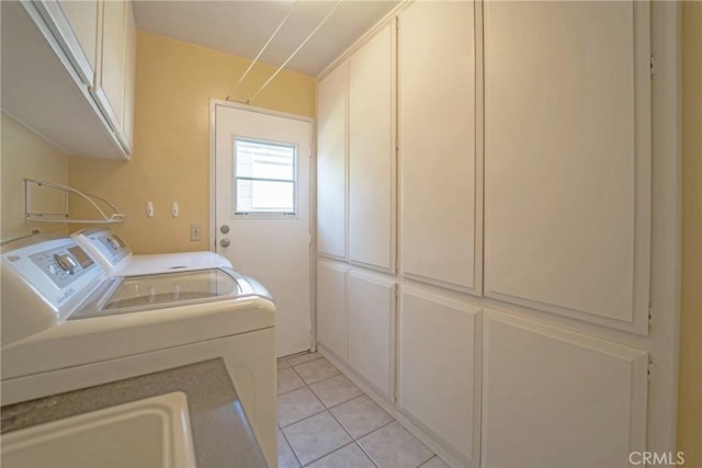 24612 Artemia Ave, Mission Viejo, CA 92691 - laundry room with cabinet space, washing machine and clothes dryer, and light tile patterned floors
