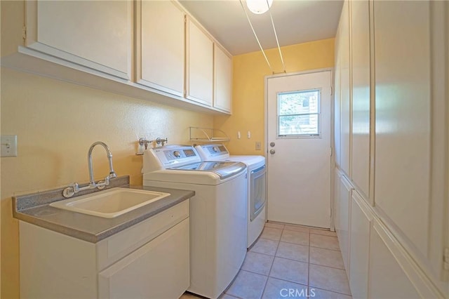 24612 Artemia Ave, Mission Viejo, CA 92691 - laundry area with washer and clothes dryer, cabinet space, and light tile patterned flooring