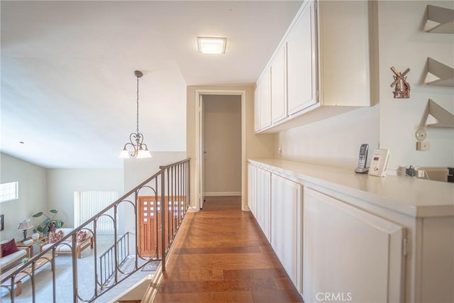 24612 Artemia Ave, Mission Viejo, CA 92691 - corridor featuring a chandelier and wood finished floors