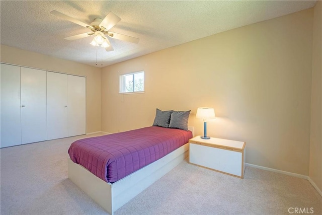 24612 Artemia Ave, Mission Viejo, CA 92691 - bedroom with carpet, a closet, a textured ceiling, and a ceiling fan