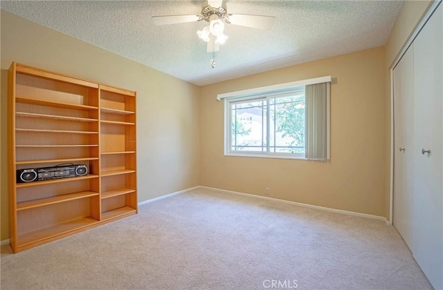 24612 Artemia Ave, Mission Viejo, CA 92691 - unfurnished bedroom with carpet floors, a closet, a textured ceiling, and a ceiling fan