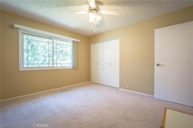 24612 Artemia Ave, Mission Viejo, CA 92691 - unfurnished bedroom with light carpet, a closet, a textured ceiling, and a ceiling fan