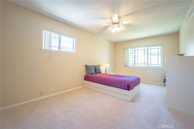 24612 Artemia Ave, Mission Viejo, CA 92691 - bedroom featuring carpet floors, a textured ceiling, and ceiling fan