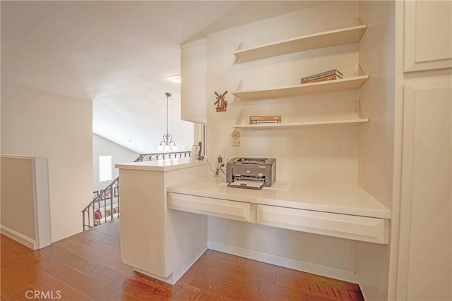 24612 Artemia Ave, Mission Viejo, CA 92691 - kitchen with vaulted ceiling, wood finished floors, light countertops, and a peninsula