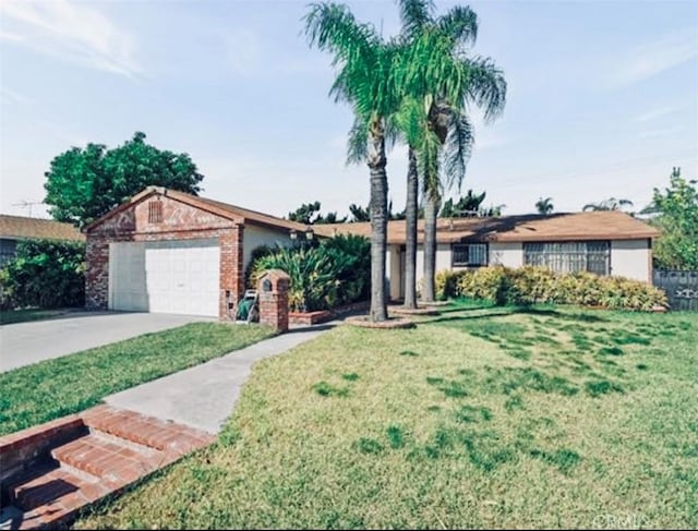 327 Flaxton St, Pomona, CA 91767 - ranch-style home featuring a front lawn, driveway, and an attached garage
