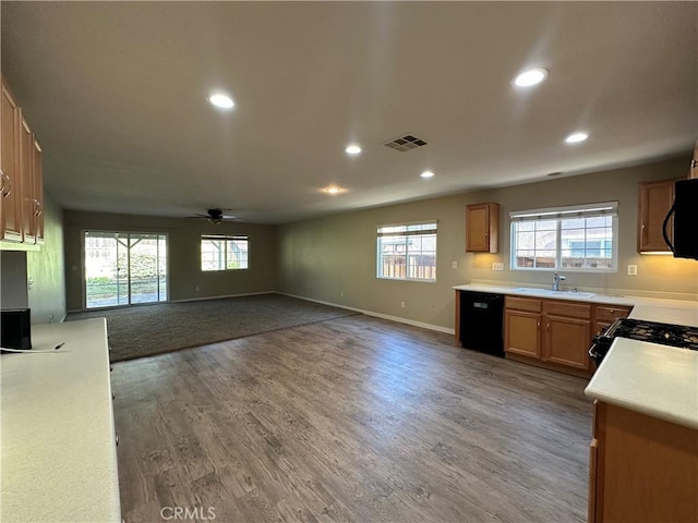 53024 Astrid Way, Lake Elsinore, CA 92532 - kitchen featuring black appliances, healthy amount of natural light, recessed lighting, a ceiling fan, and light countertops
