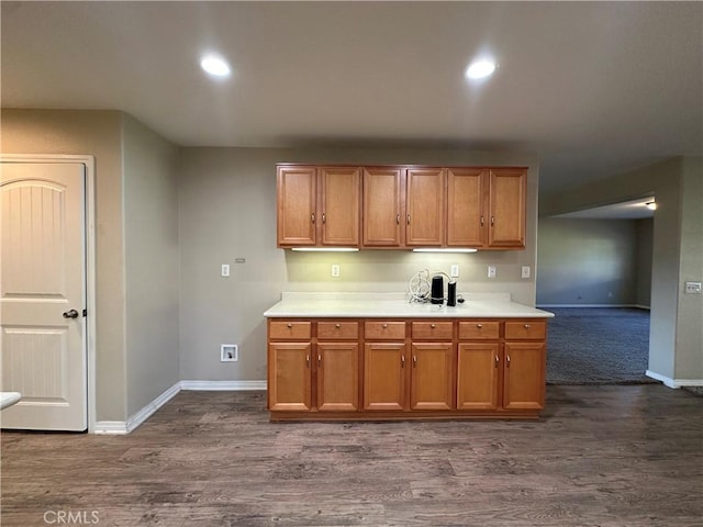 53024 Astrid Way, Lake Elsinore, CA 92532 - kitchen featuring light countertops, dark wood finished floors, brown cabinets, and recessed lighting