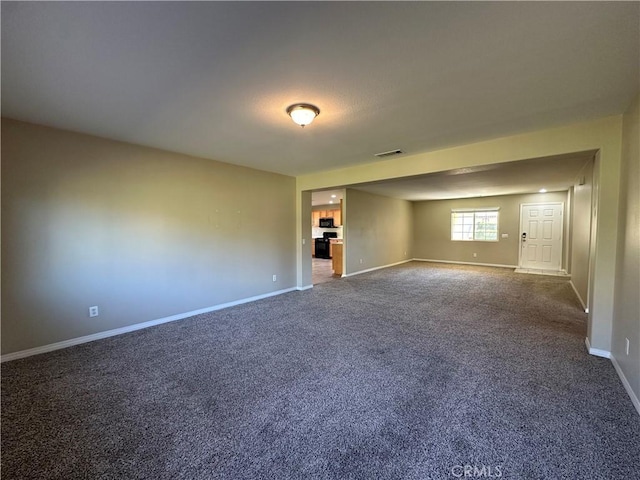 53024 Astrid Way, Lake Elsinore, CA 92532 - unfurnished room featuring baseboards and dark carpet