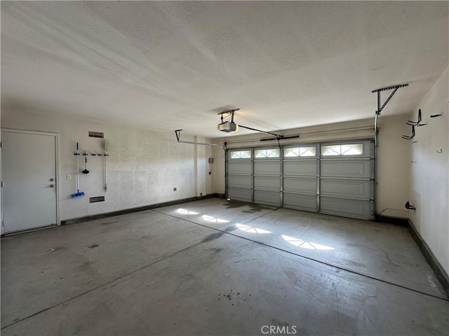53024 Astrid Way, Lake Elsinore, CA 92532 - garage with a garage door opener and baseboards