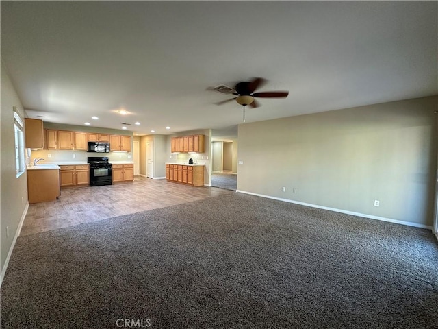 53024 Astrid Way, Lake Elsinore, CA 92532 - unfurnished living room with light colored carpet, recessed lighting, and ceiling fan