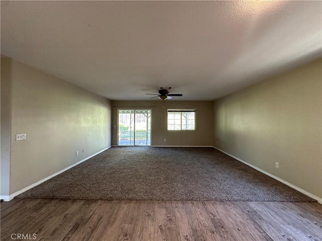 53024 Astrid Way, Lake Elsinore, CA 92532 - unfurnished room with a ceiling fan and dark wood-type flooring