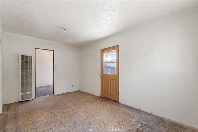 505 W Glendon Way, San Gabriel, CA 91776 - unfurnished room with a heating unit and a textured ceiling