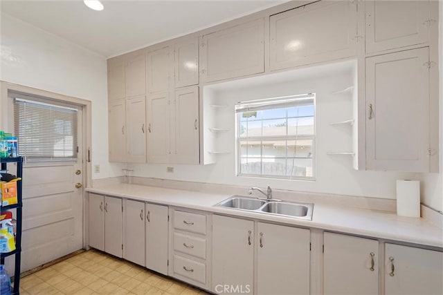 505 W Glendon Way, San Gabriel, CA 91776 - kitchen featuring open shelves, light countertops, white cabinetry, and light flooring