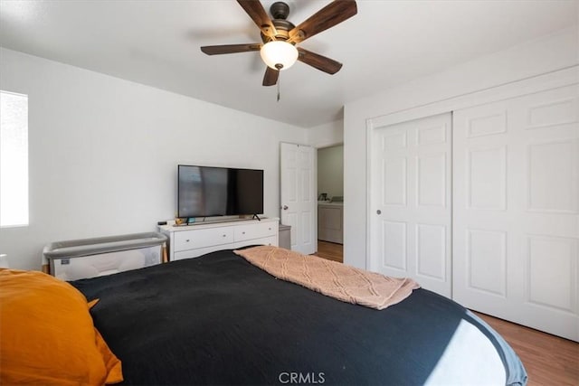1812 Riverside Ave, Paso Robles, CA 93446 - bedroom featuring washer / dryer, wood finished floors, a closet, and ceiling fan