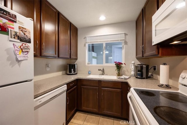 1812 Riverside Ave, Paso Robles, CA 93446 - kitchen with white appliances, light tile patterned floors, recessed lighting, and dark brown cabinetry