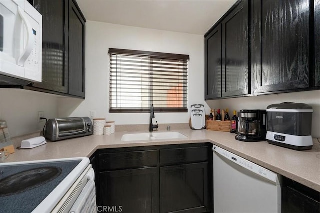 1812 Riverside Ave, Paso Robles, CA 93446 - kitchen with white appliances, dark cabinets, and light countertops
