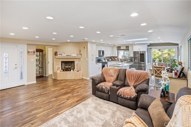 20092 E Frank Ln, Orange, CA 92869 - living area featuring recessed lighting, light wood-style flooring, and a premium fireplace