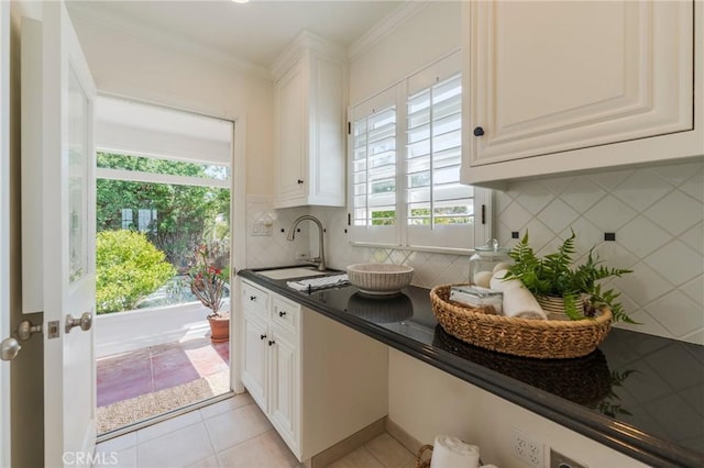 426 Via La Selva, Redondo Beach, CA 90277 - kitchen featuring dark countertops, decorative backsplash, white cabinets, ornamental molding, and light tile patterned floors
